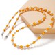 A chain for glasses, beads, an orange pendant
